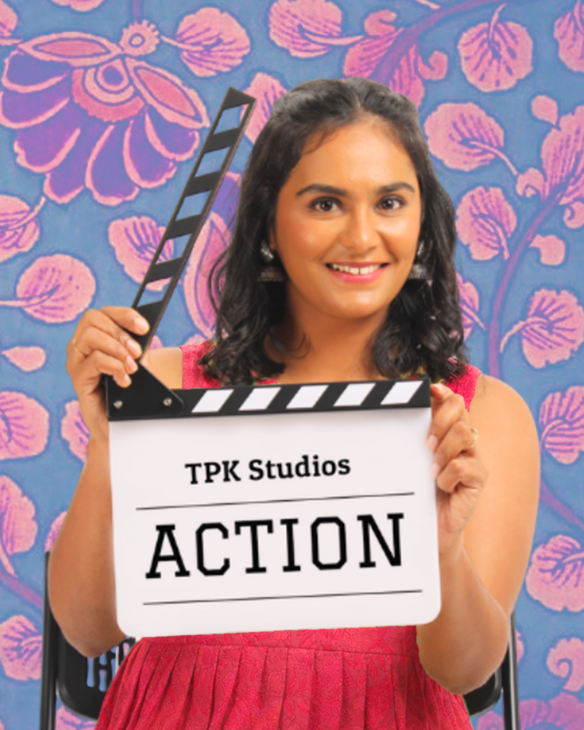 ActingClass student holding a clapperboard